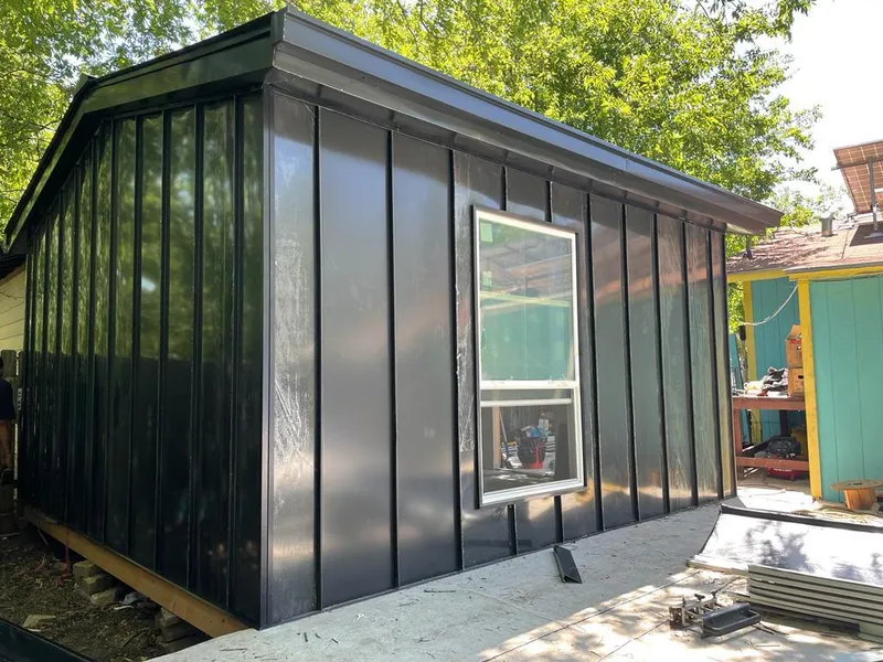 Black standing seam metal wall panels for Roof Inspection in Harwinton